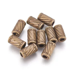 10db. Köztes fémgyöngy.. 11x6mm. Antik bronz szín.