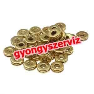 Korong. 7x3mm.  Antik arany szín. Fémgyöngy, köztes gyöngy.