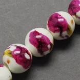 Porcelán ékszergyöngy. 10mm. Sötét pink virág.