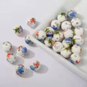 Porcelán ékszer gyöngy. 10mm. Színes virágok.