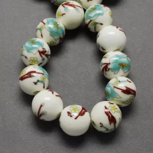 Porcelán ékszer gyöngy. 6, 8, vagy 10mm. Zöldes virág.