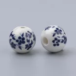 Porcelán ékszergyöngy. 10mm. Poroszkék virág.