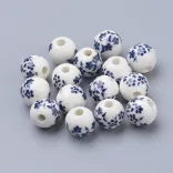 Porcelán ékszergyöngy. 10mm. Poroszkék virág.