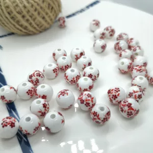 Porcelán gyöngy. 6mm. Bordó virágok. 