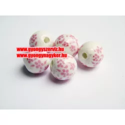 Porcelán gyöngy 10mm. Rózsaszín apró virág.