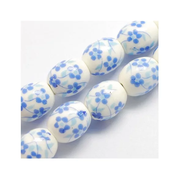 Porcelán ékszergyöngy. 12x10mm. Királykék virág.