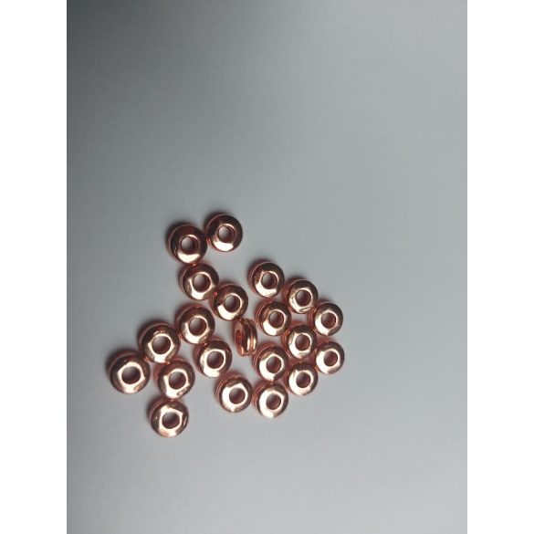 10db. Köztes korong gyöngy. 6x3mm. Rózsaarany szín.