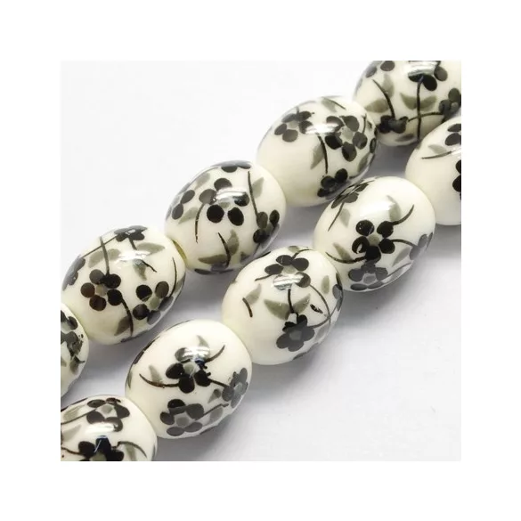 Porcelán ékszergyöngy. 12x10mm. Fekete virág. 