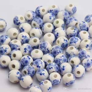Porcelán gyöngy 10mm. Kék virágok.