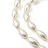 Üveg tekla gyöngy. Rizs forma. 16x8mm. Világos krém. 