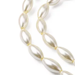 Üveg tekla gyöngy. Rizs forma. 16x8mm. Világos krém. 