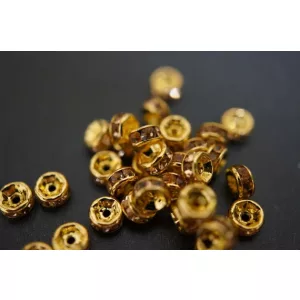 10db.  Strasszos köztes gyöngy, rondella. 6mm. Arany-pezsgő.